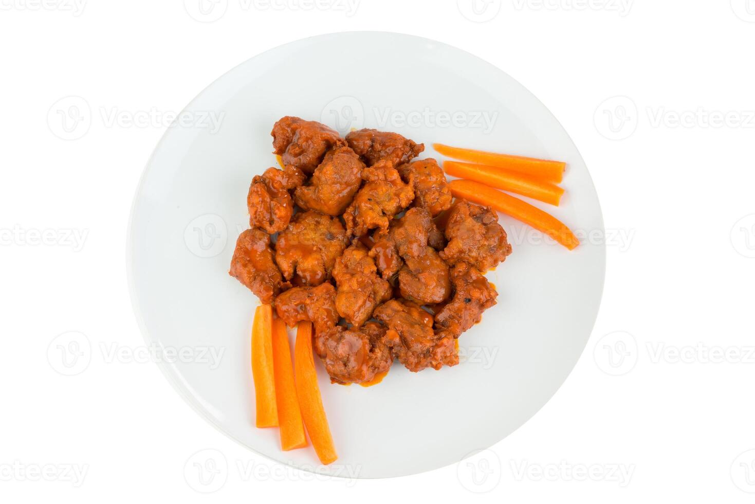 Boneless chicken wings with buffalo sauce and carrots photo