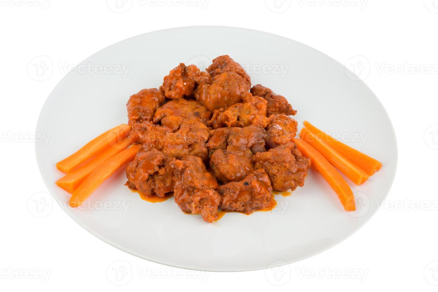 Boneless chicken wings with buffalo sauce and carrots photo