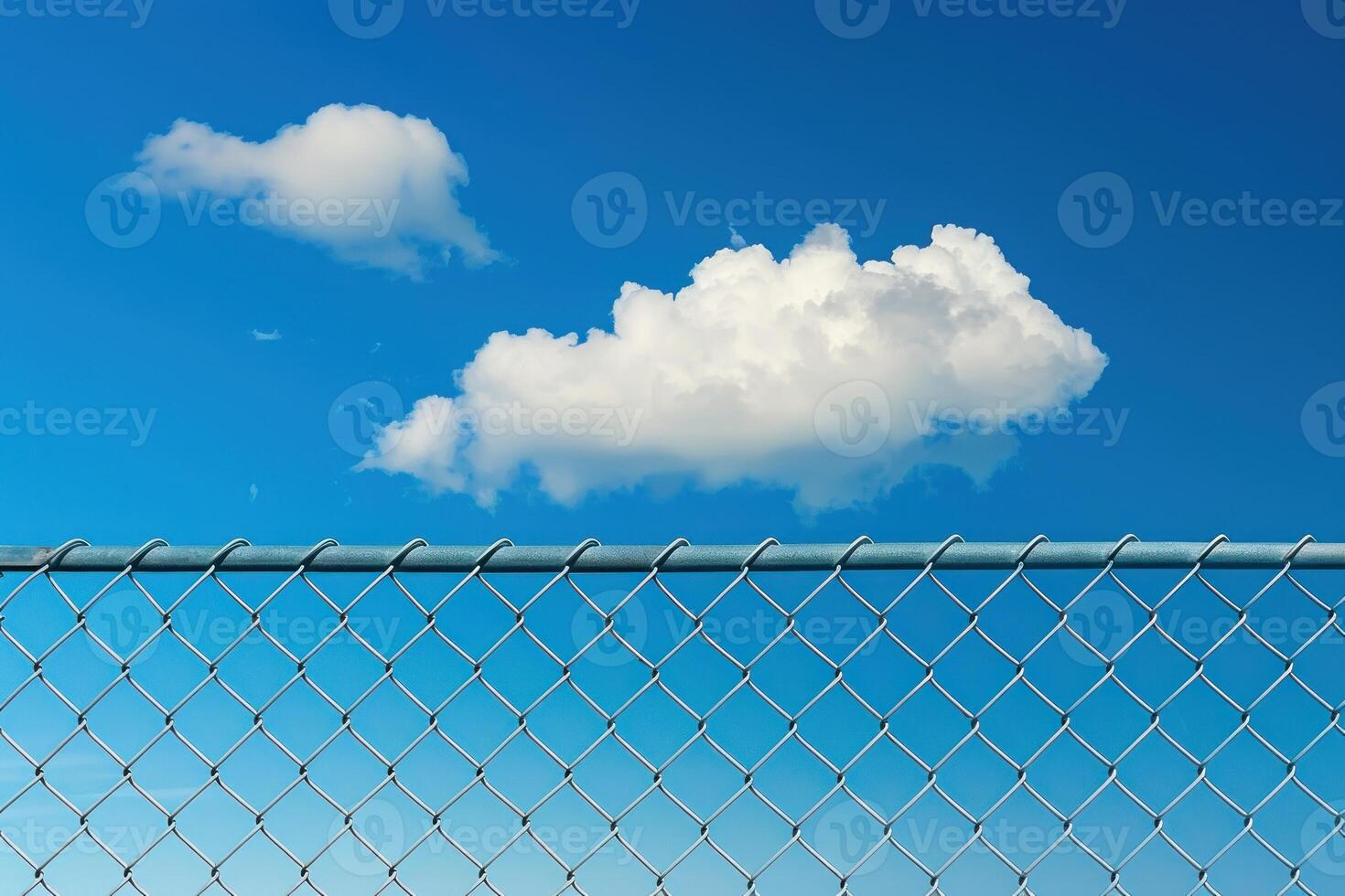 A cloudless blue sky with a large cloud in the middle photo