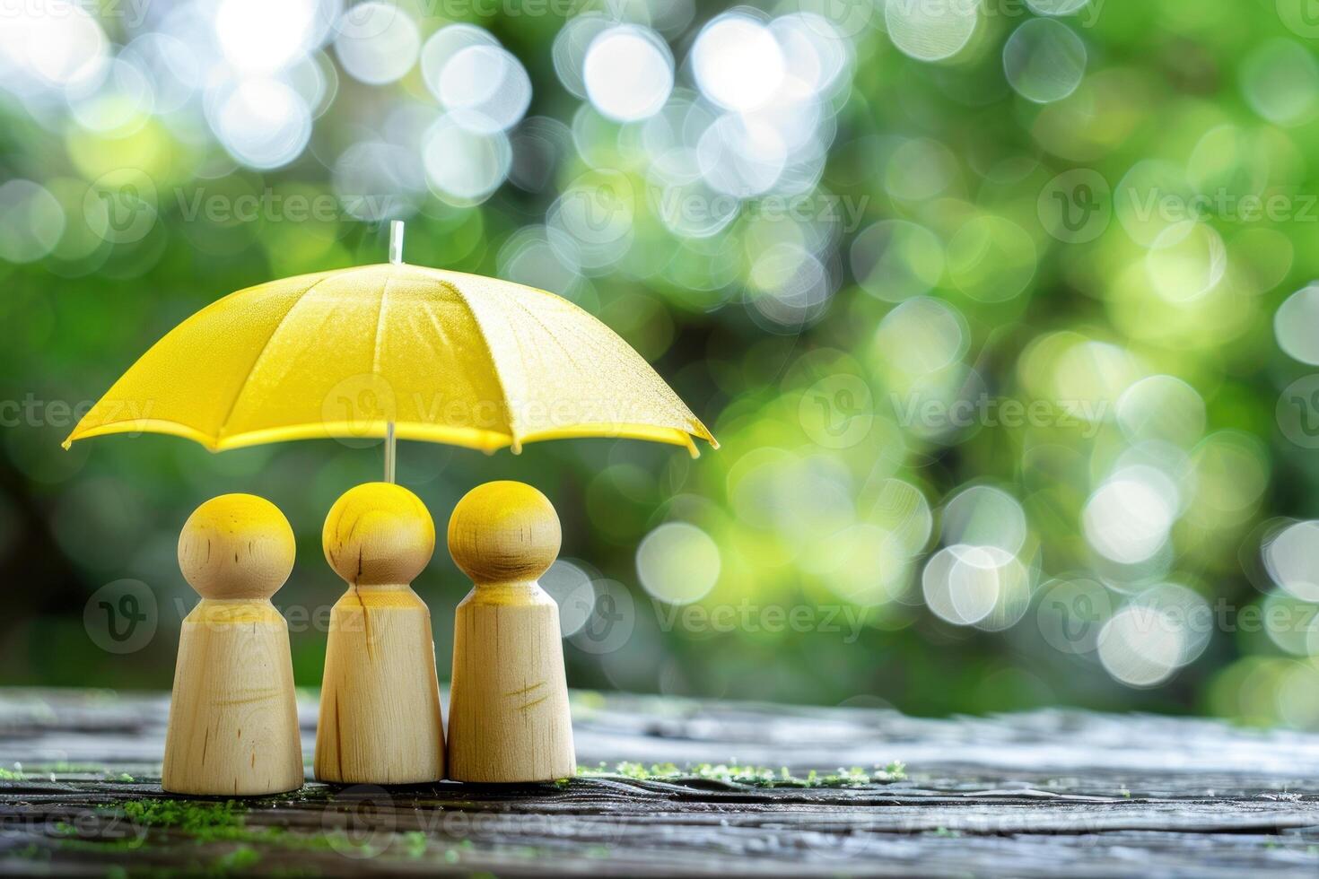 Two people are standing under a yellow umbrella photo