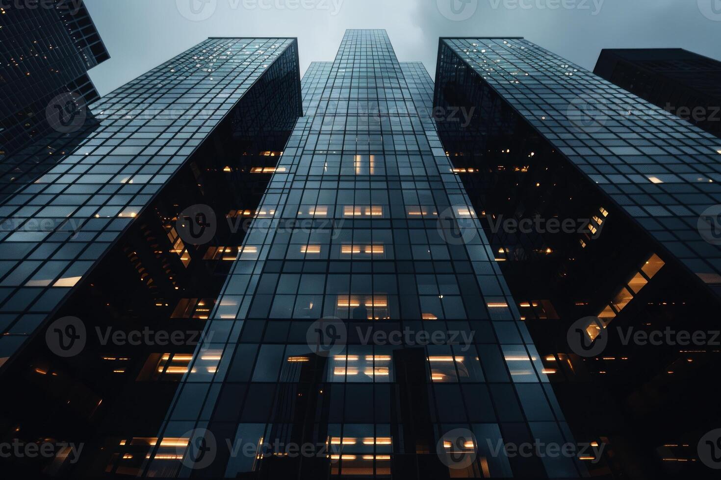 A city skyline with tall buildings and a cloudy sky photo