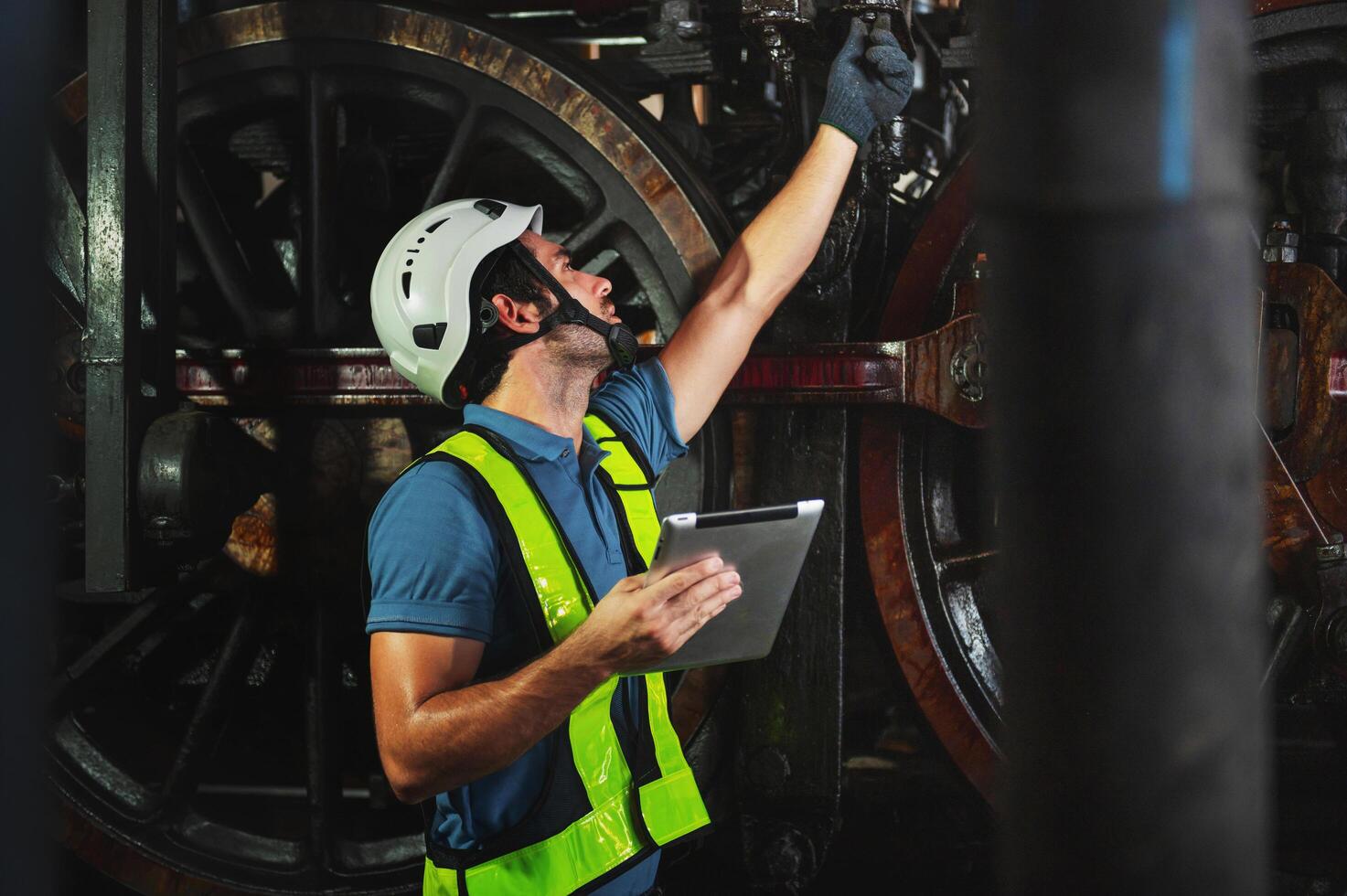 maintenance engineer working operating machines in industry factory photo