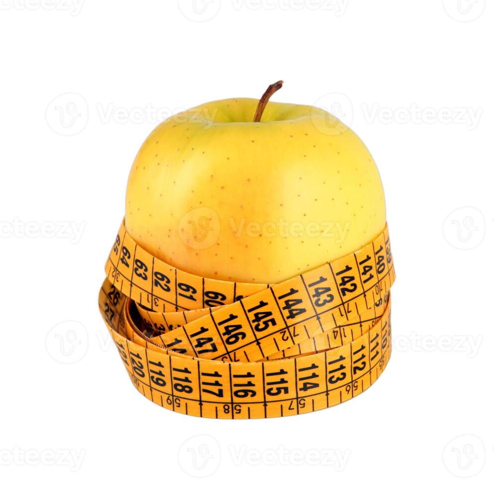 Diet concept with green apple wrapped with measuring tape photo