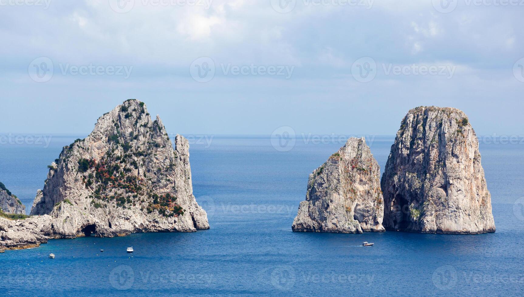 Faraglioni, famous giant rocks, Capri island photo