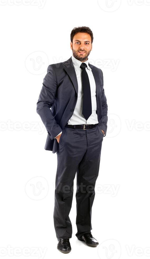 a man in a suit and tie standing with his hands on his hips photo