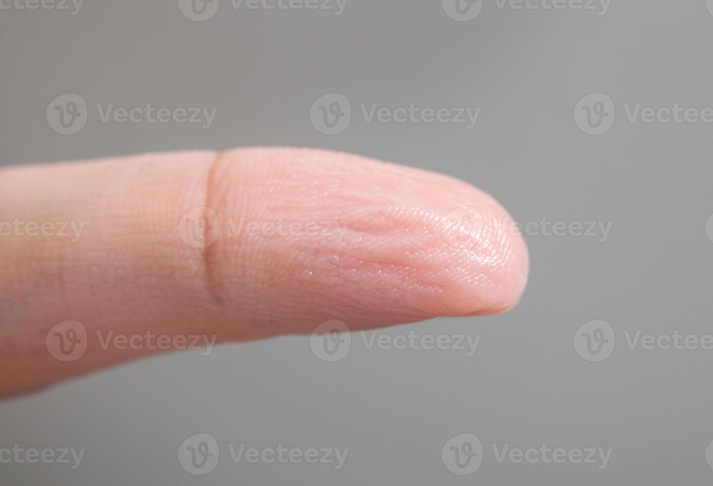 Wrinkled skin of finger photo