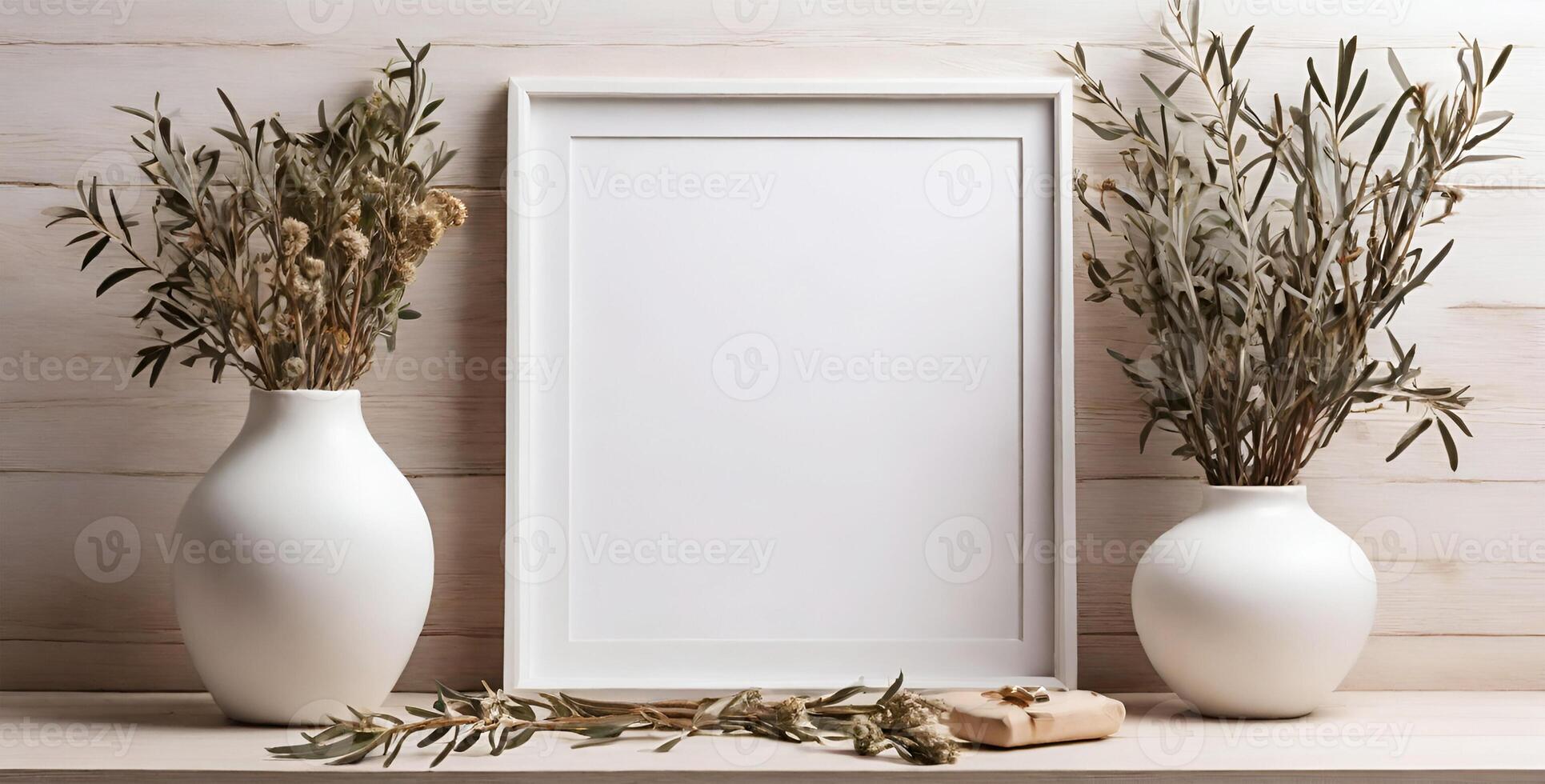 white vases with olive branches and a blank frame photo