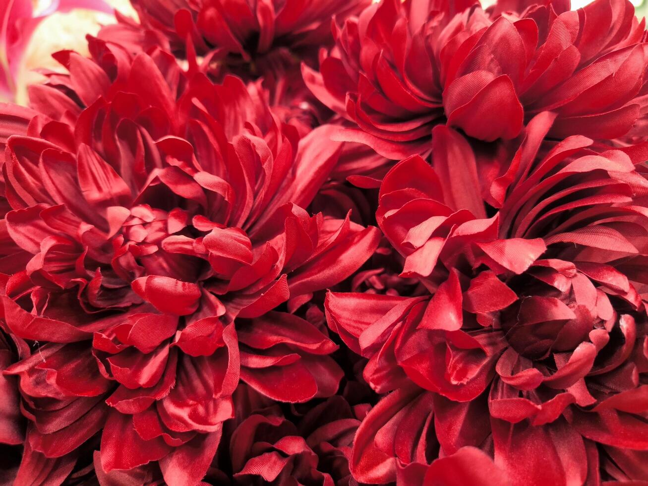 Red flower is made from Plastic . Plastic background pattern photo