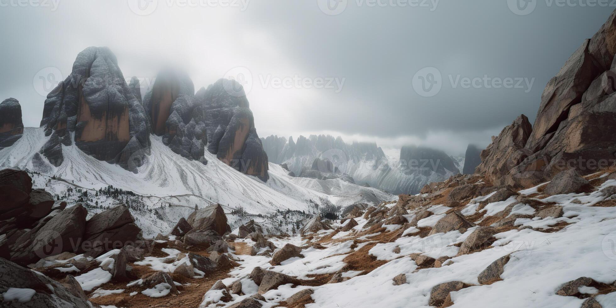 Cloud day rock hill mountain rock peak with snow at winter. Adventure expedition travel hiking scene view photo