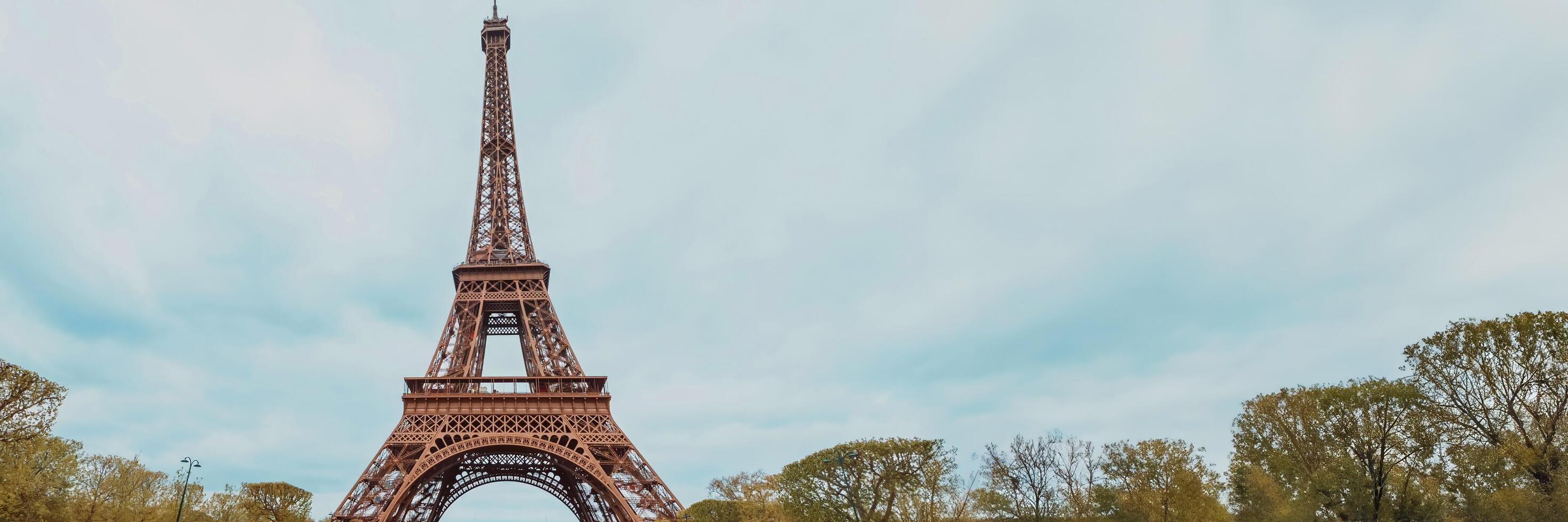 Springtime panoramic view of the Eiffel Tower in Paris, France, with clear blue skies on Bastille Day, April 14th, 2024, ideal for travel and holiday themes photo