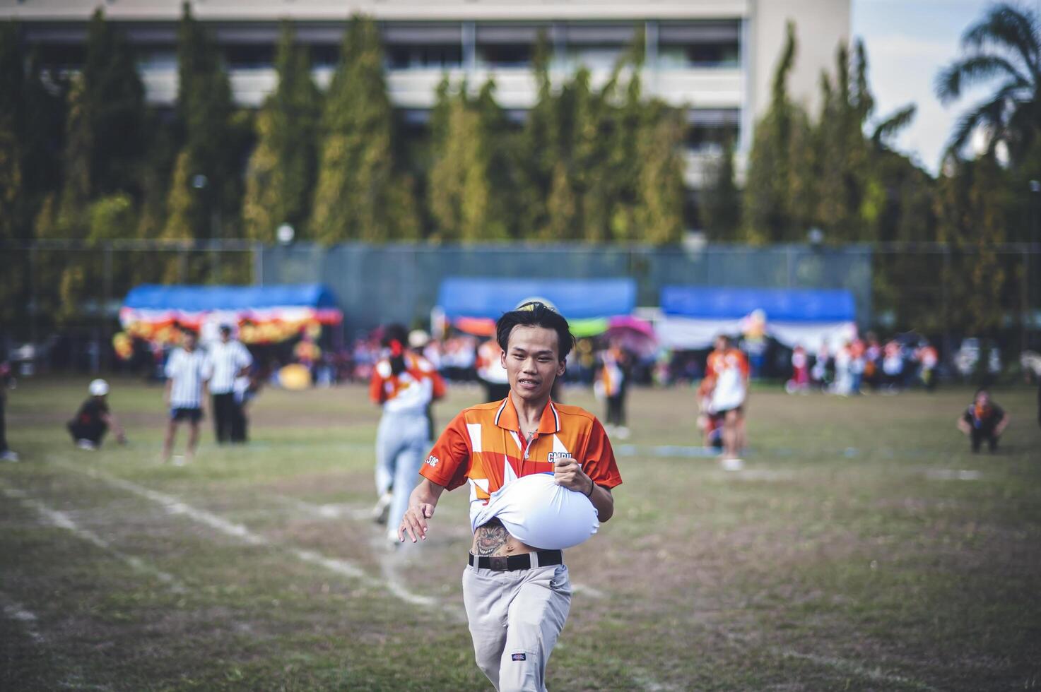 ChiangMai Thailand  November 30 2022  Asian teenage students are doing a sack race for unity in Chiang Mai Rajabhat University photo