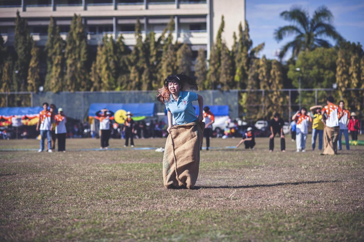 ChiangMai Thailand  November 30 2022  Asian teenage students are doing a sack race for unity in Chiang Mai Rajabhat University photo