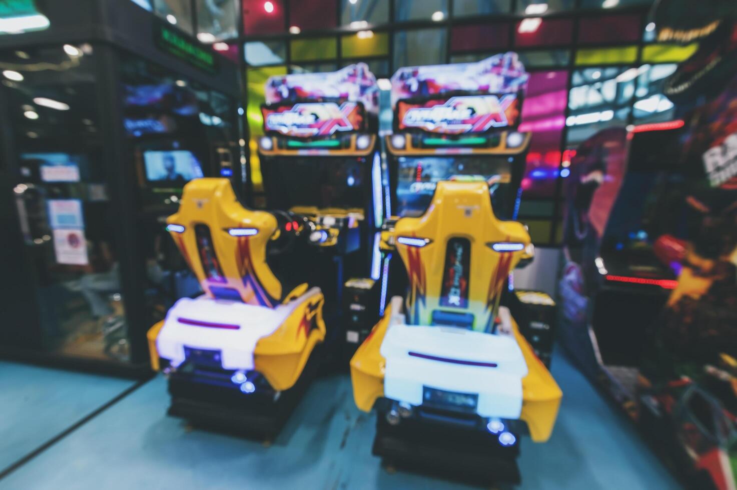 Blurred image of amusement park, children's rides in shopping mall. photo