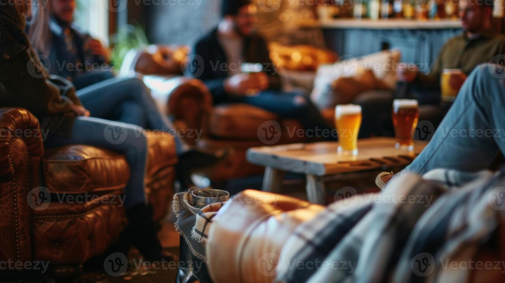 Guests relax on couches and chairs in a cozy taproom sipping on pints of nonalcoholic beer and chatting with friends photo