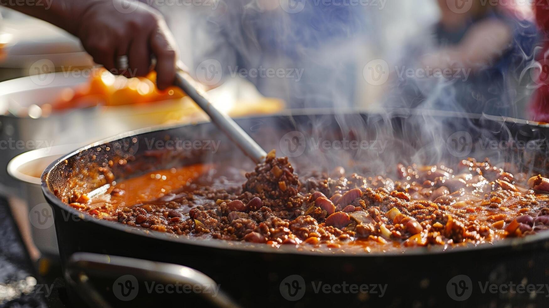 The intense heat of a chili cookoff competition has contestants sweating as they craft their secret recipes with tongues wagging in anticipation photo