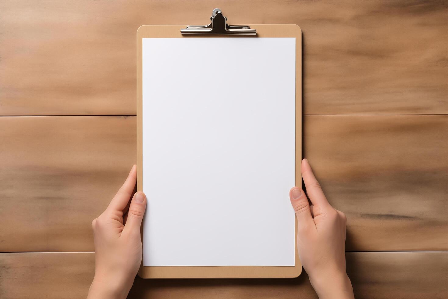 A person holding a clipboard with a blank sheet of paper on it, ready to jot down notes or instructions. photo