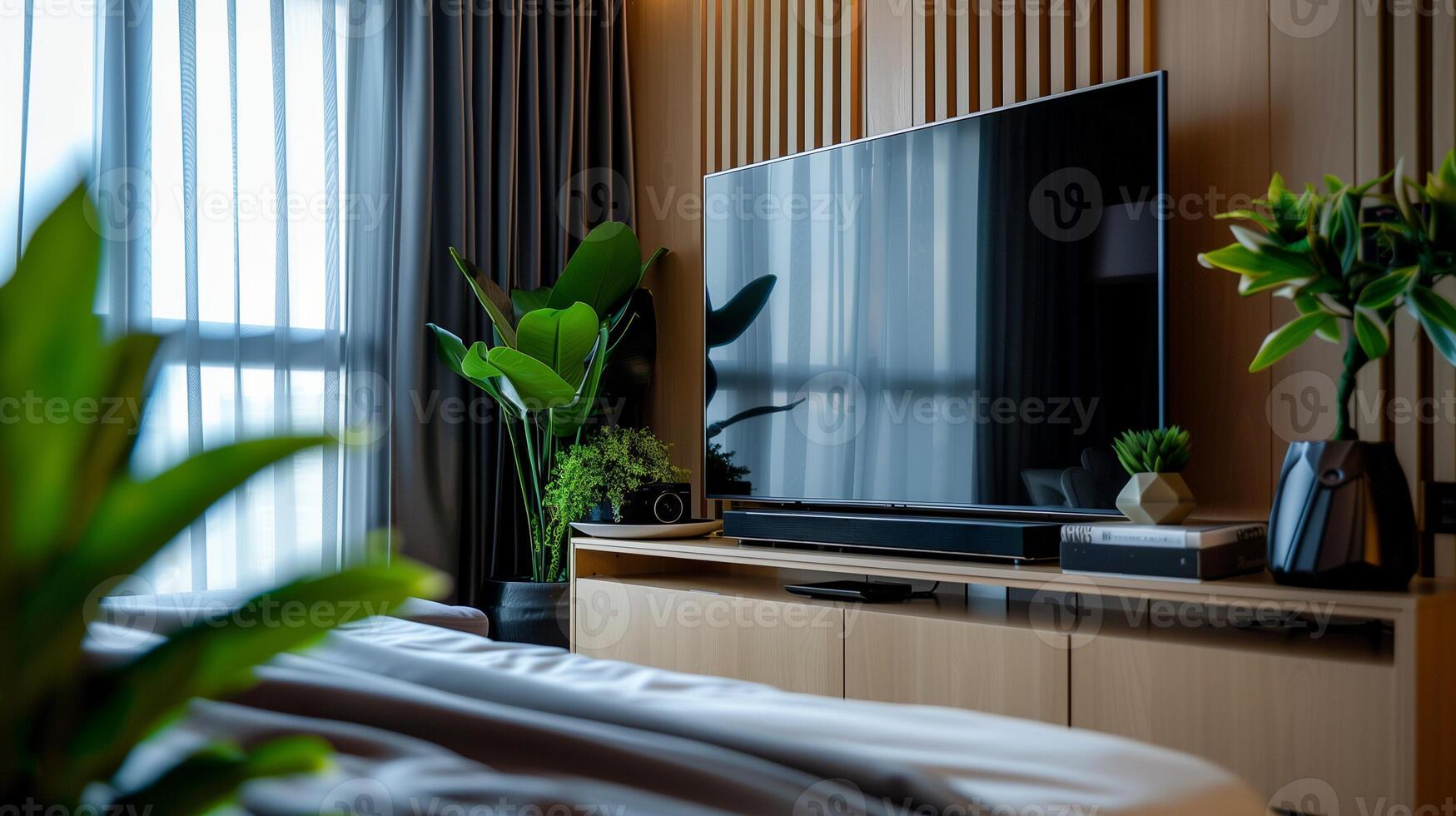 Modern living room with large flat screen TV and houseplants, showcasing interior design and home entertainment concepts, ideal for advertising and real estate photo