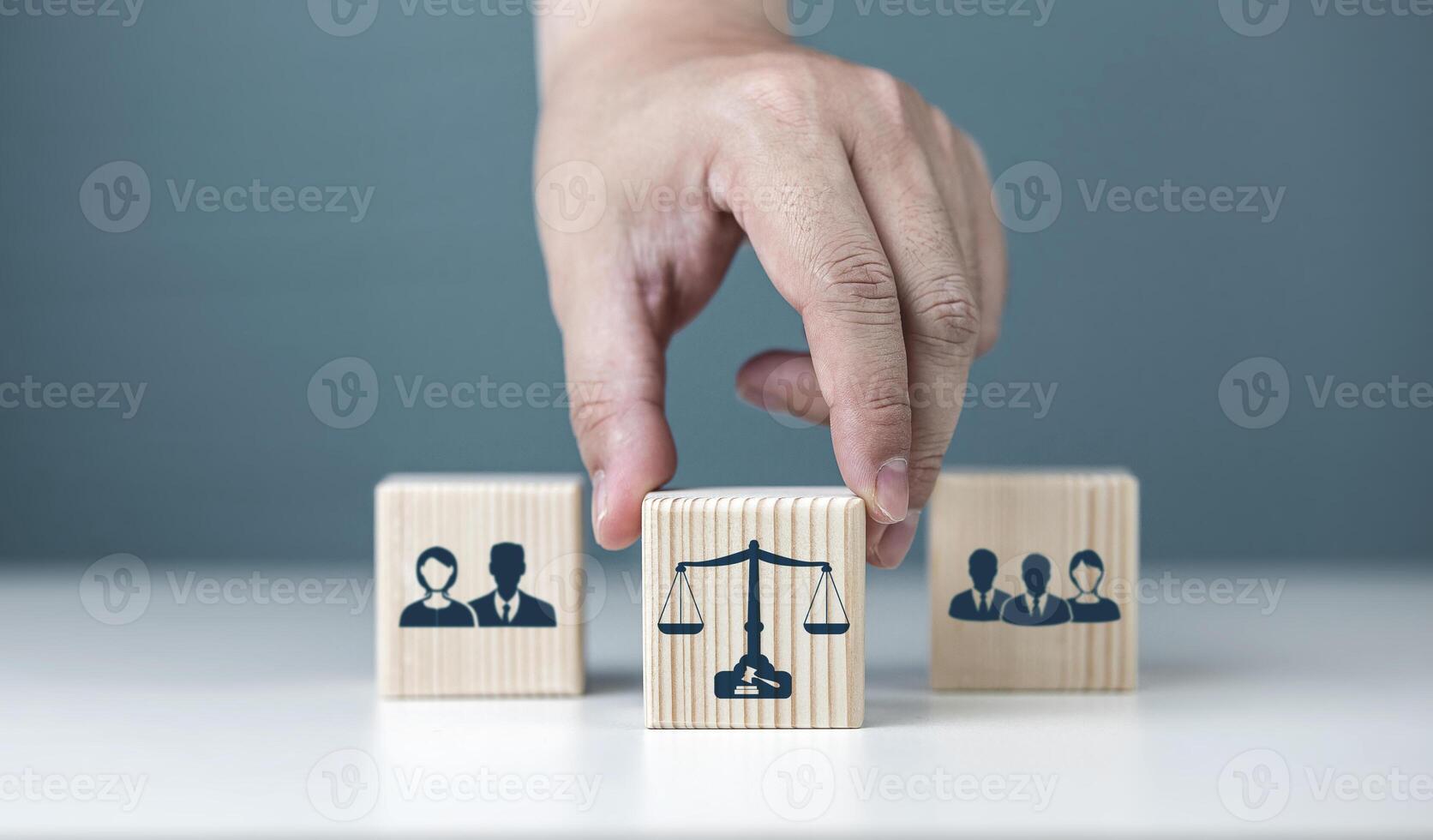 Law, judicial decision, and Business Conflict Resolution. Wooden block with court symbols with culprit and defendant photo