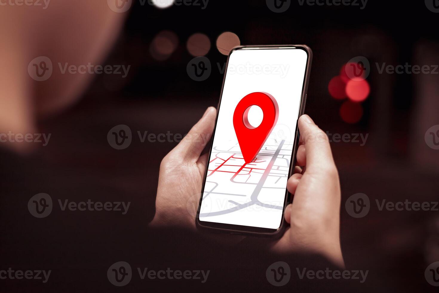 Destination red pin, Global Positioning System GPS and navigation map concept. Young woman's hand searching for location in online map on smartphone photo