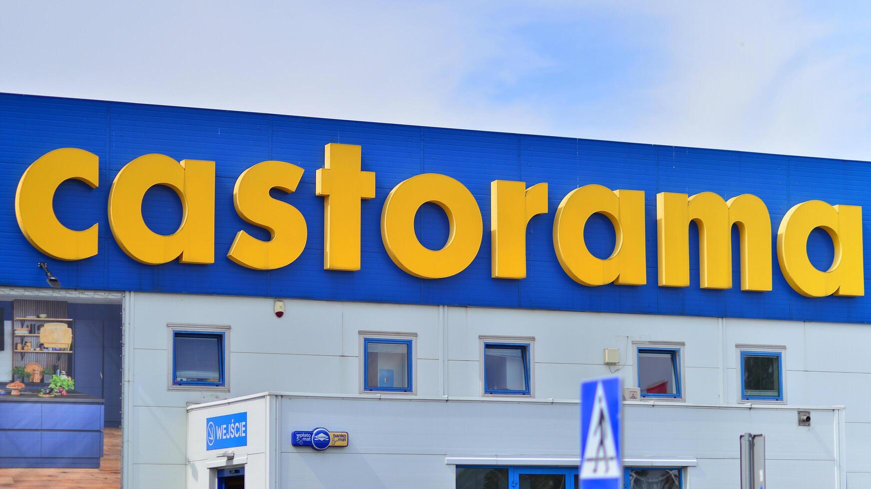 Warsaw, Poland. 28 April 2024. Signboard with brand logo of Castorama home improvement retailer and building supplies store. photo