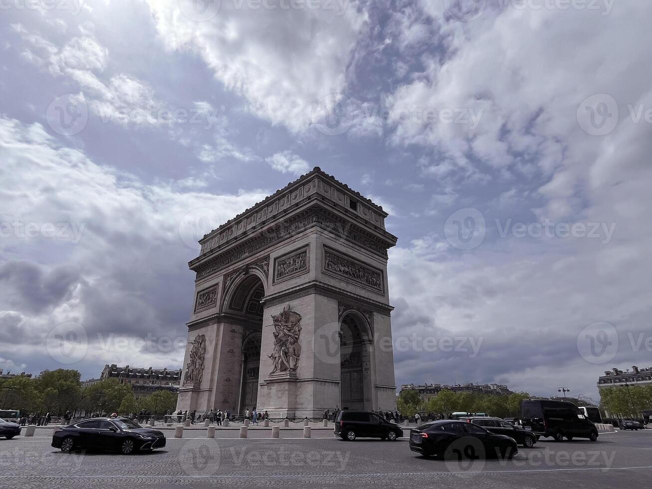 Triumphal arch in Paris capital of France, famous tourist attraction on cloudy day, monument to glorify Napoleon victory, national heritage, Arc de Triomphe on Charles de Gaulle square, city scenery photo