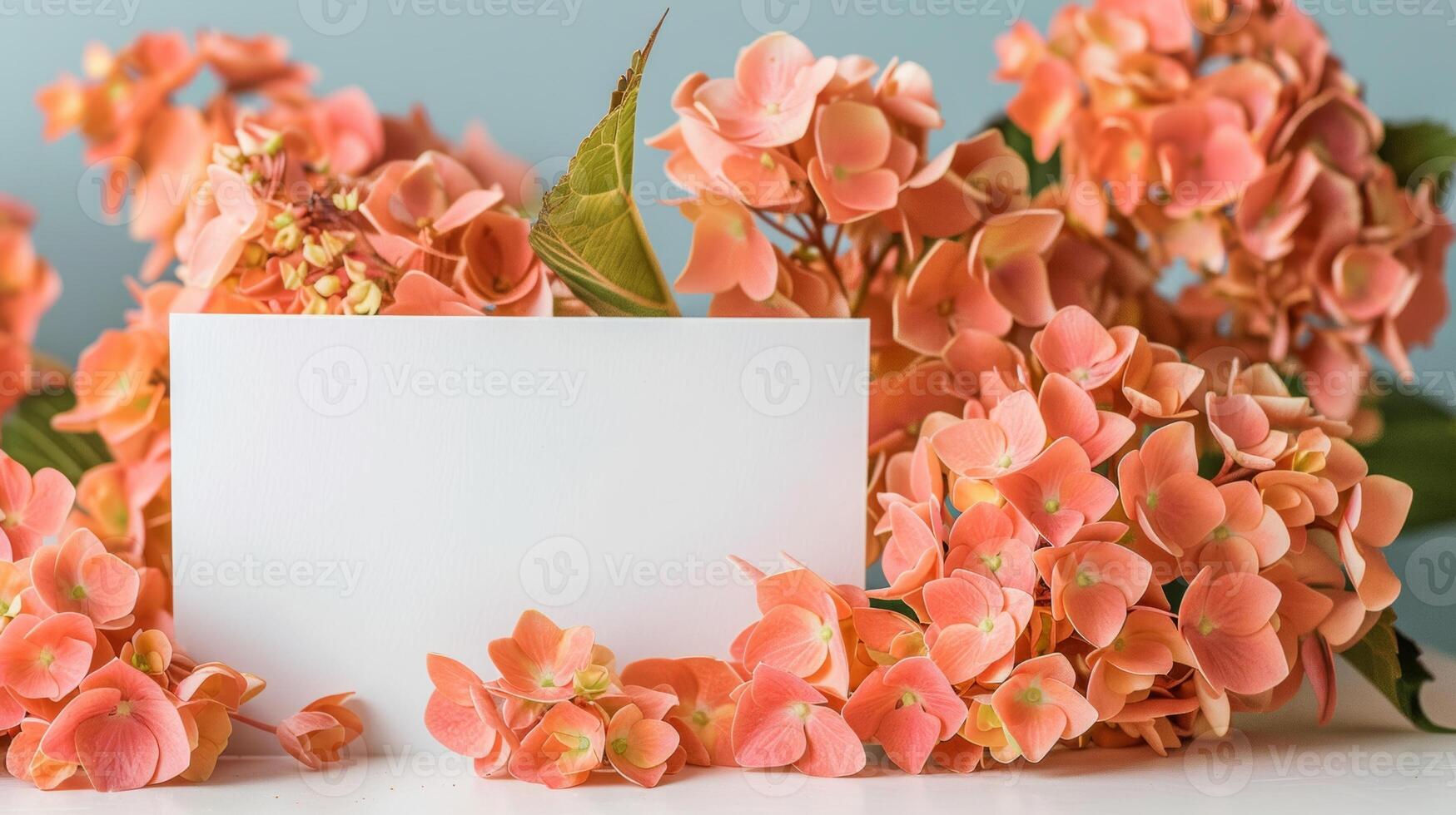 mockup of a white card beside orange hydrangea bouquet, soft pastel tones photo