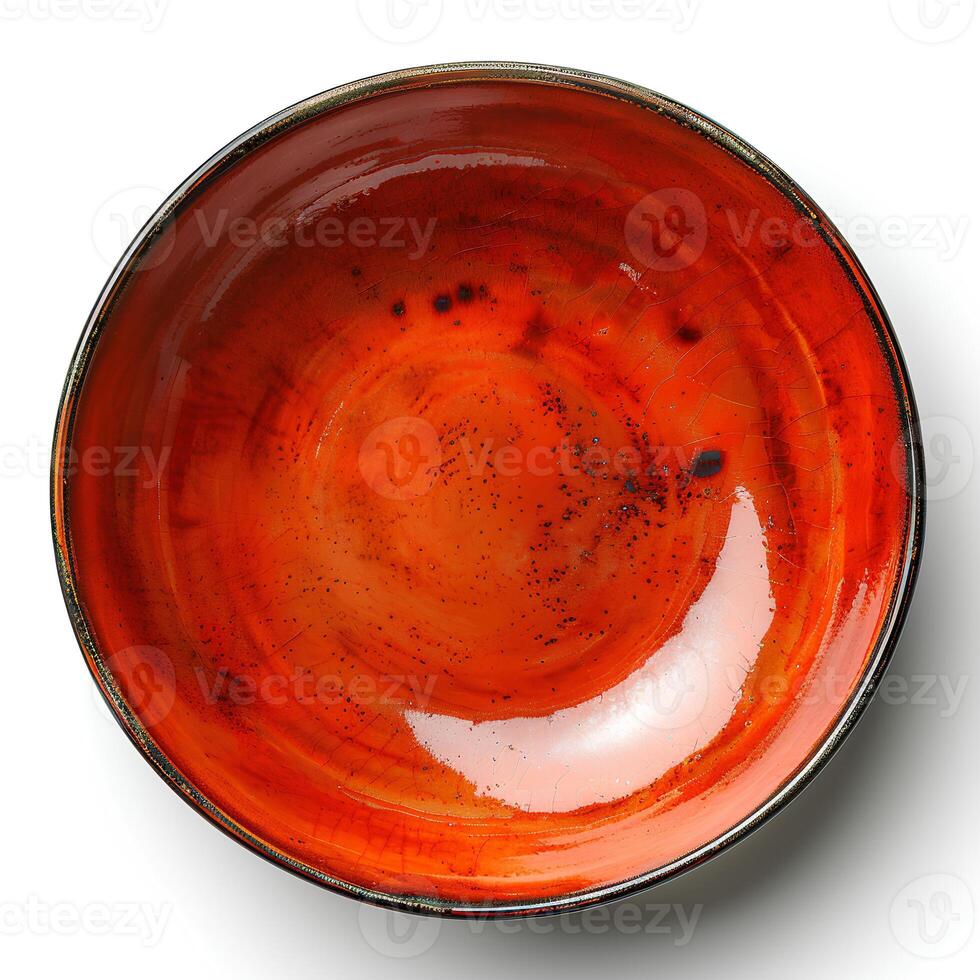 Red ceramic plate isolated on white background with shadow. Red plate with texture top view photo