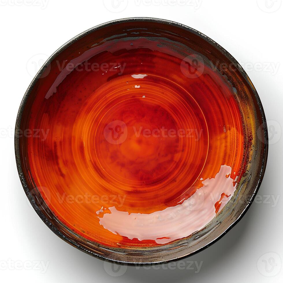 Red ceramic plate isolated on white background with shadow. Red plate with texture top view photo