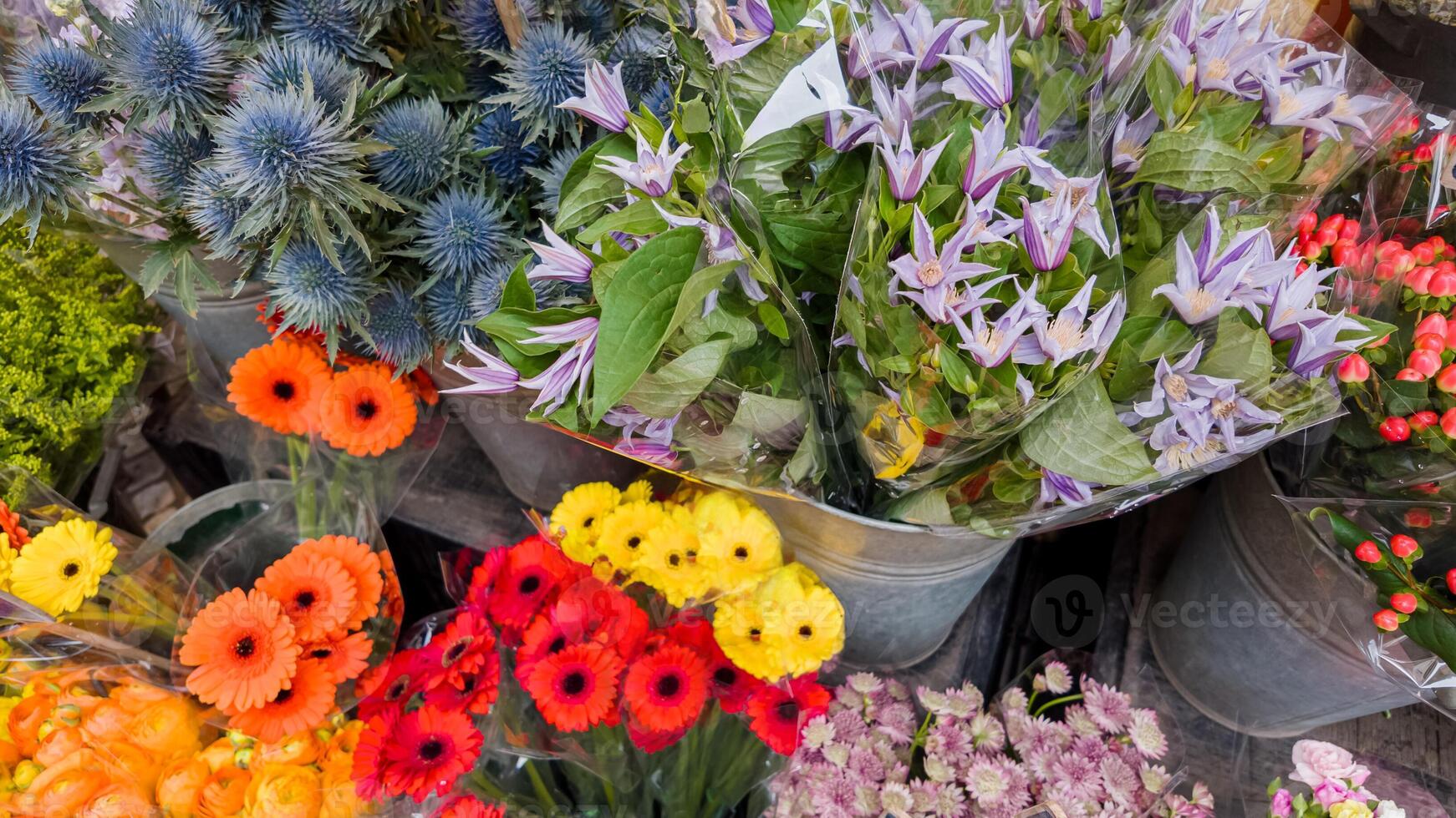 Variety of fresh colorful flowers at a market, ideal for Mothers Day or International Womens Day bouquets and spring celebrations photo