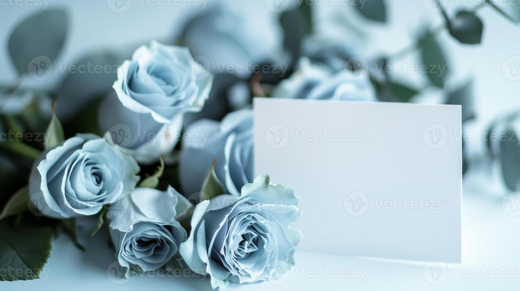 mockup of a white card beside blue rose bouquet, soft pastel tones photo