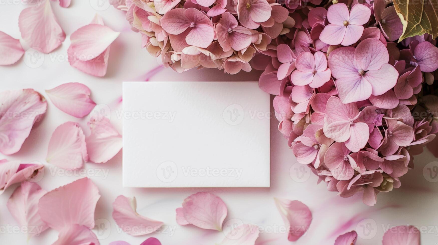 mockup of a white card beside pink hydrangea bouquet, soft pastel tones photo