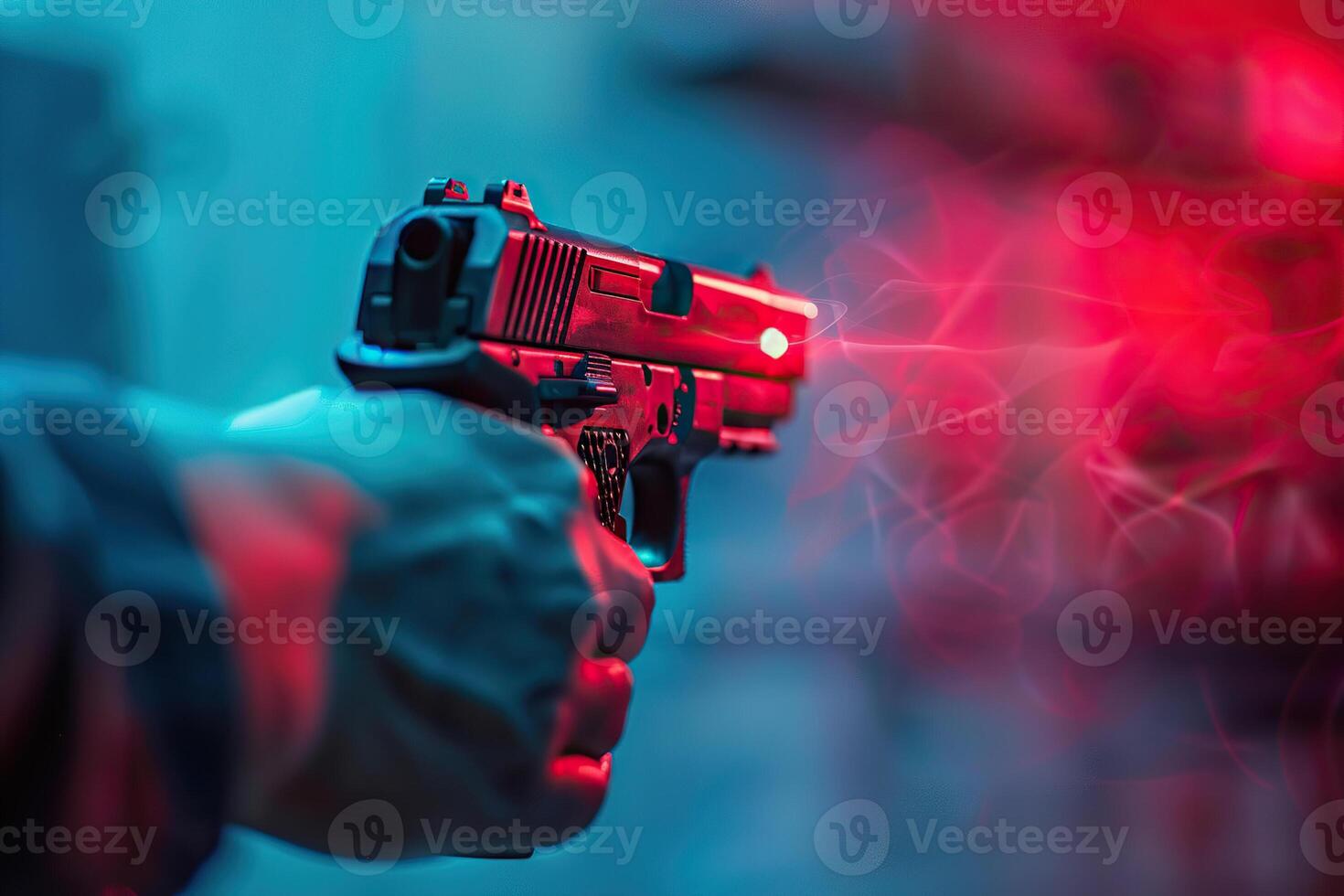 on theme of man with pistol in powerful male hand aims red laser sight at the target photo