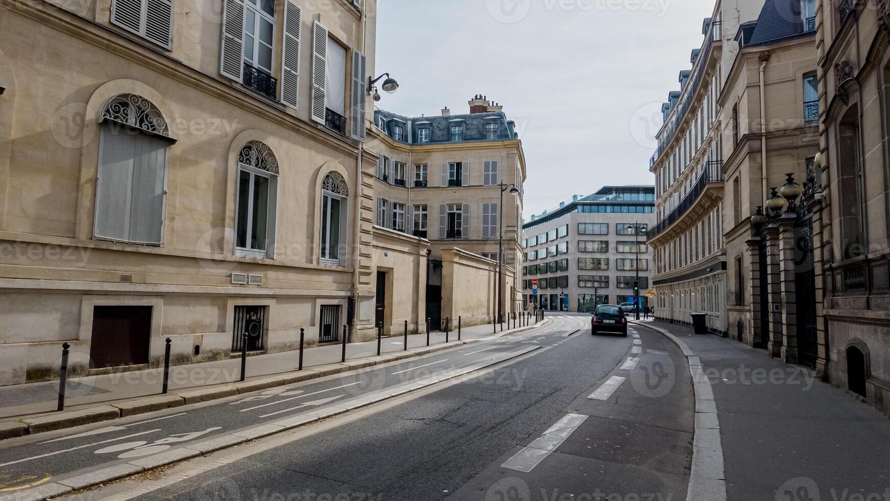 Quiet Parisian street with classic architecture on a cloudy day, ideal for travel themes and European cityscapes photo