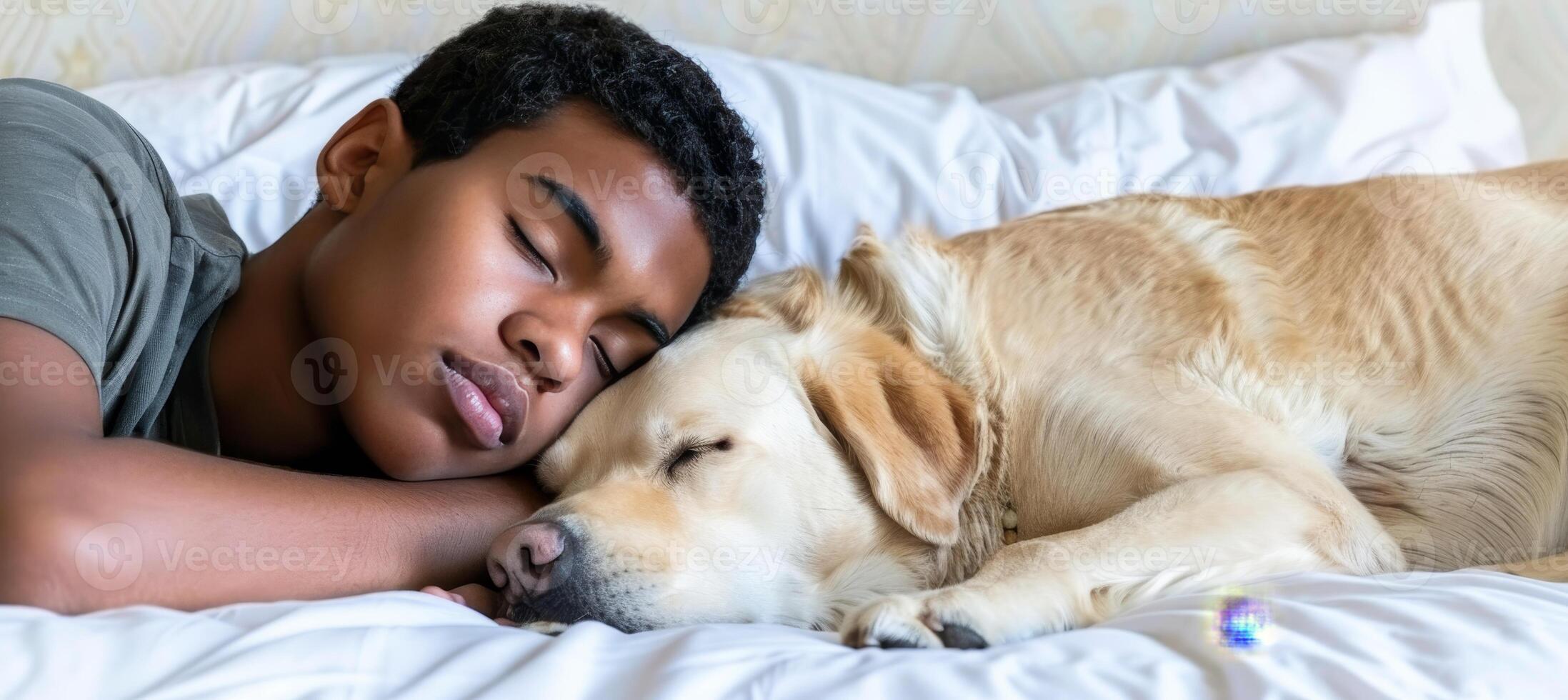 Young man and dog peacefully sleeping together on a white bed in a cozy home setting photo