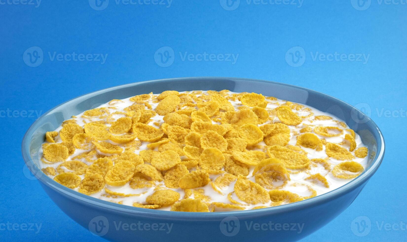 Corn flakes with milk, bowl of cereal breakfast photo