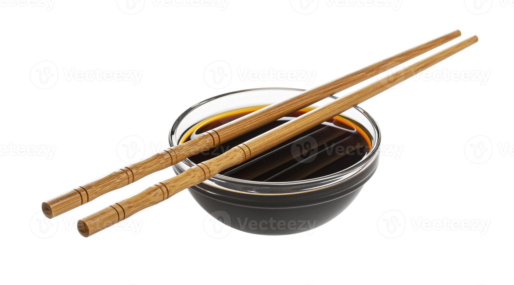 Soy sauce and chopsticks isolated on white background photo