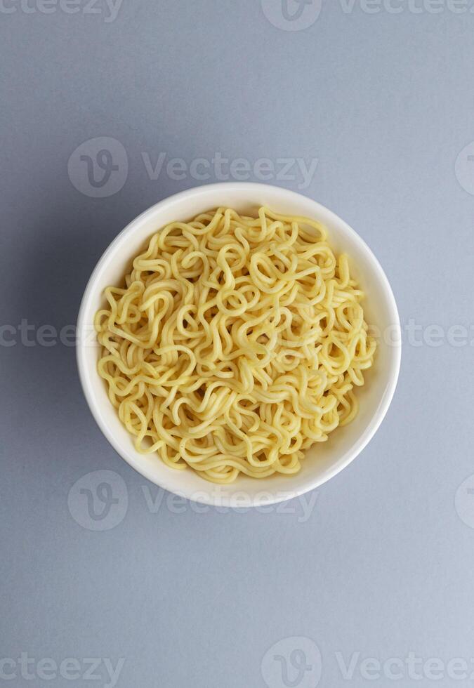 Instant noodles in white plate, top view photo