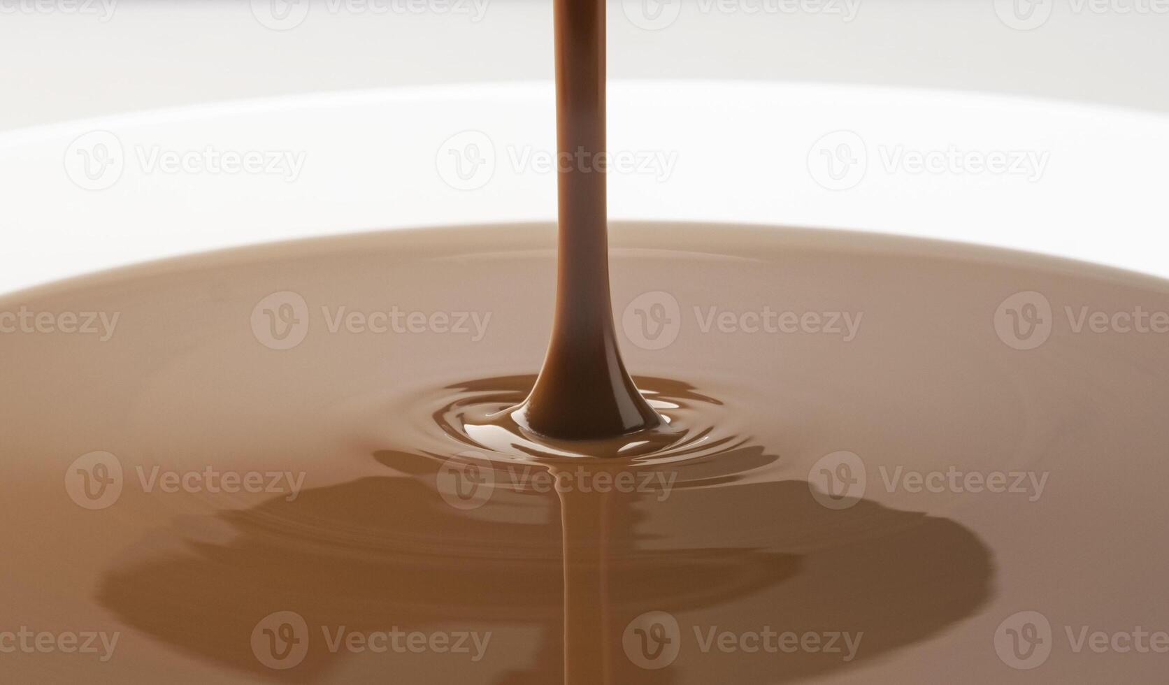 Close-up of pouring melted chocolate photo