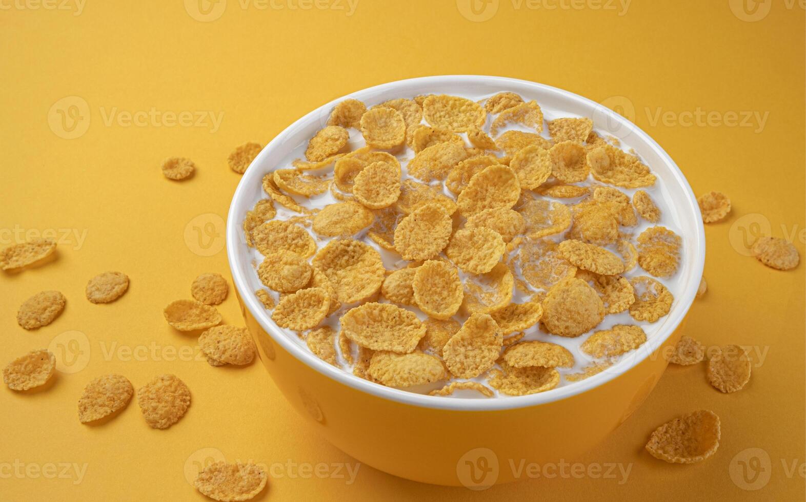 Corn flakes with milk, bowl of cereal breakfast photo