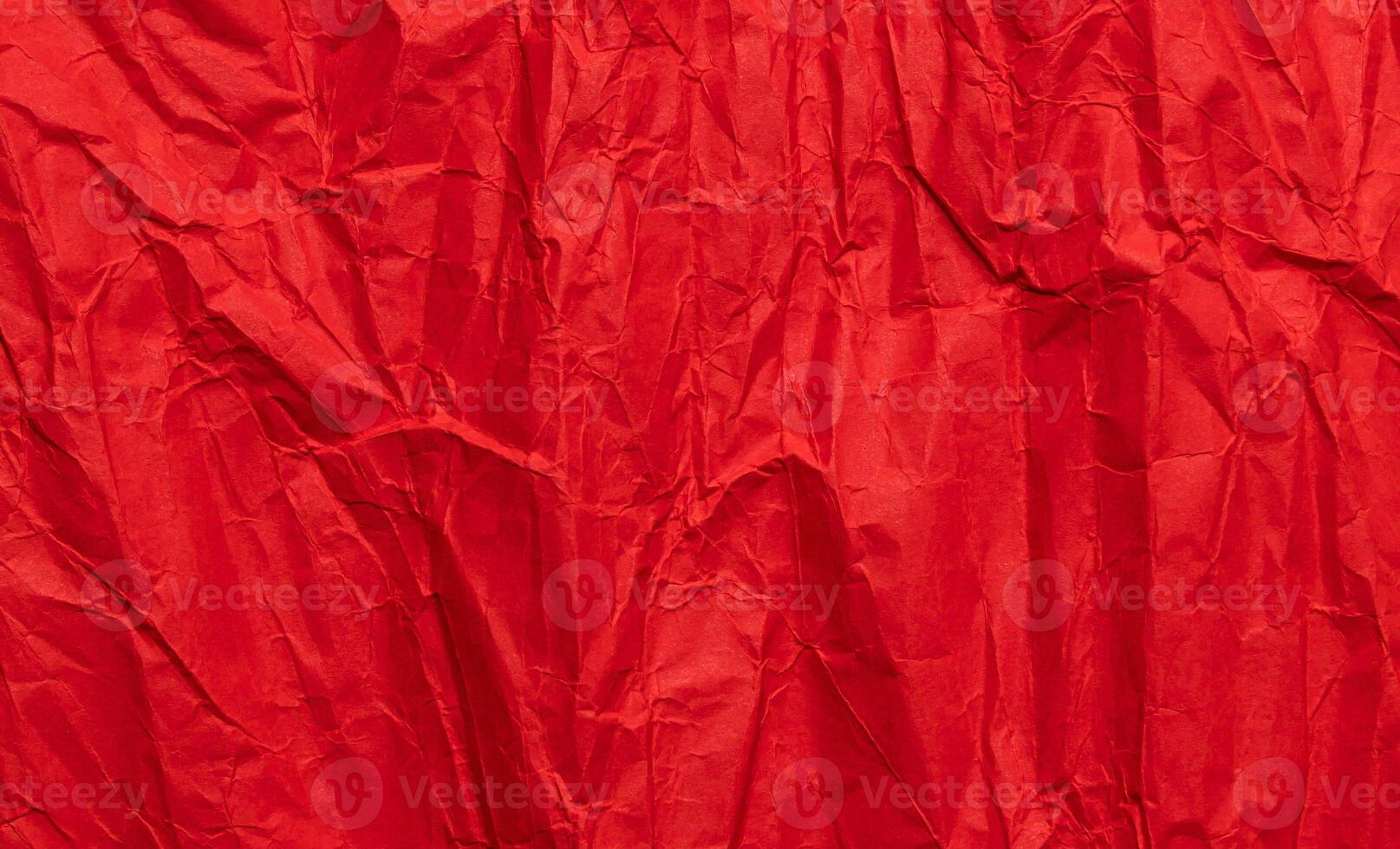 Red crumpled paper texture, grunge background photo