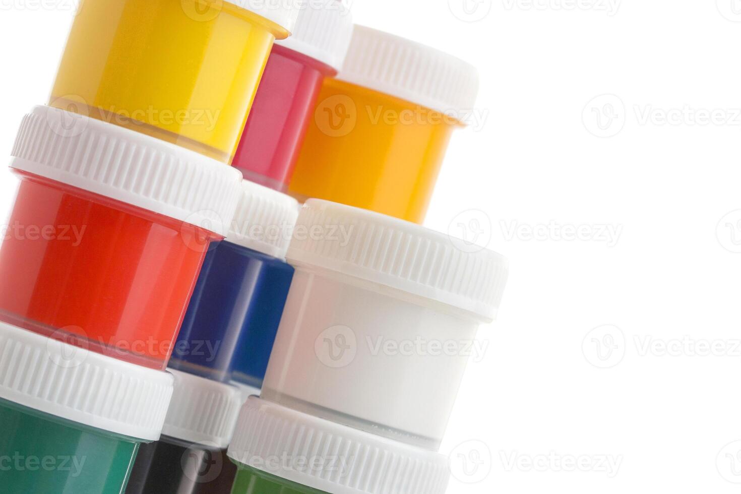 Close-up of gouache paint cans on white background photo