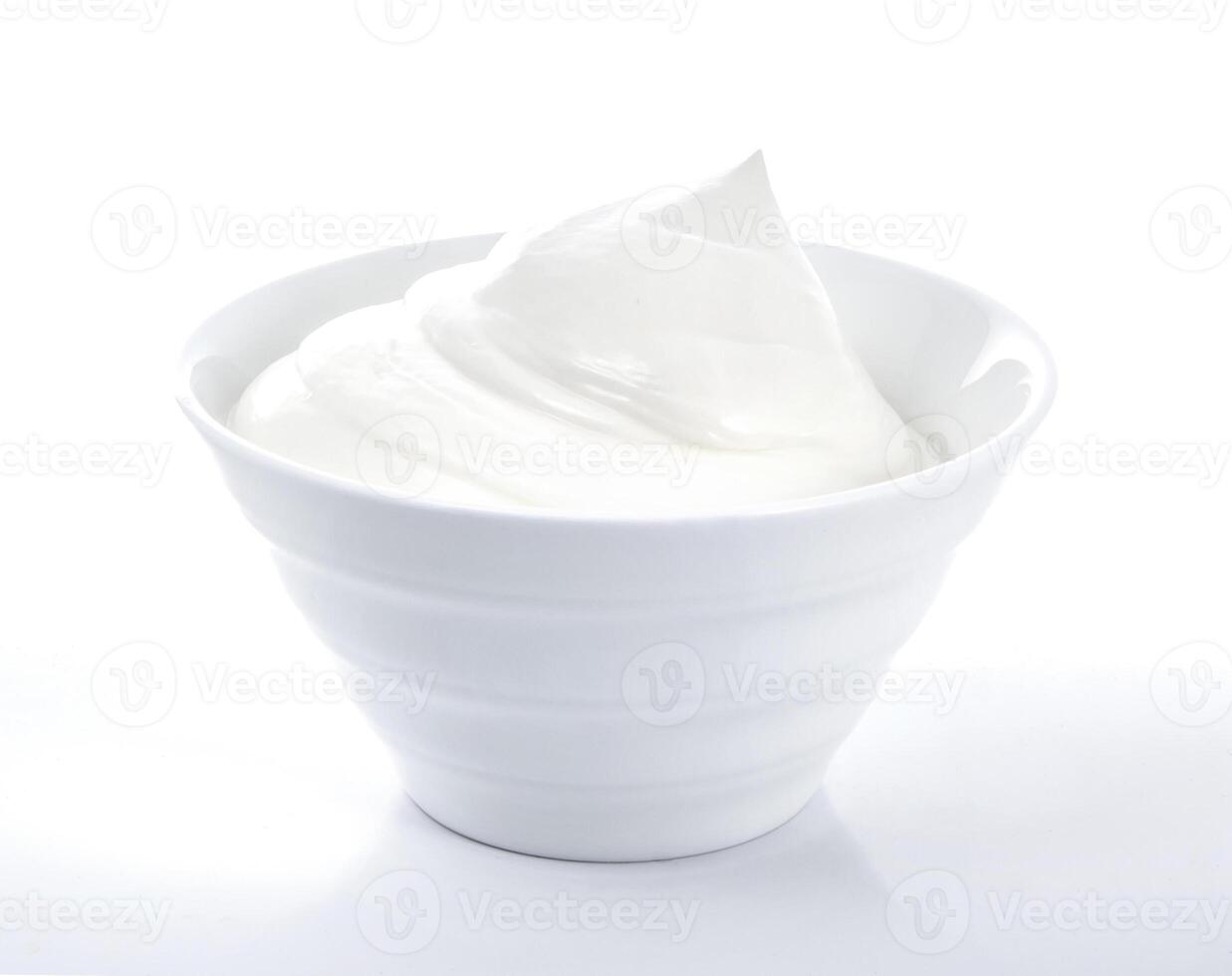 Bowl of cream on white background photo