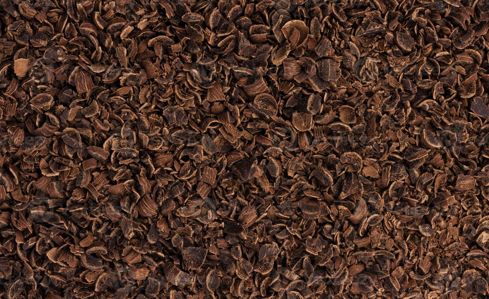 Grated chocolate texture. Ground chocolate background photo