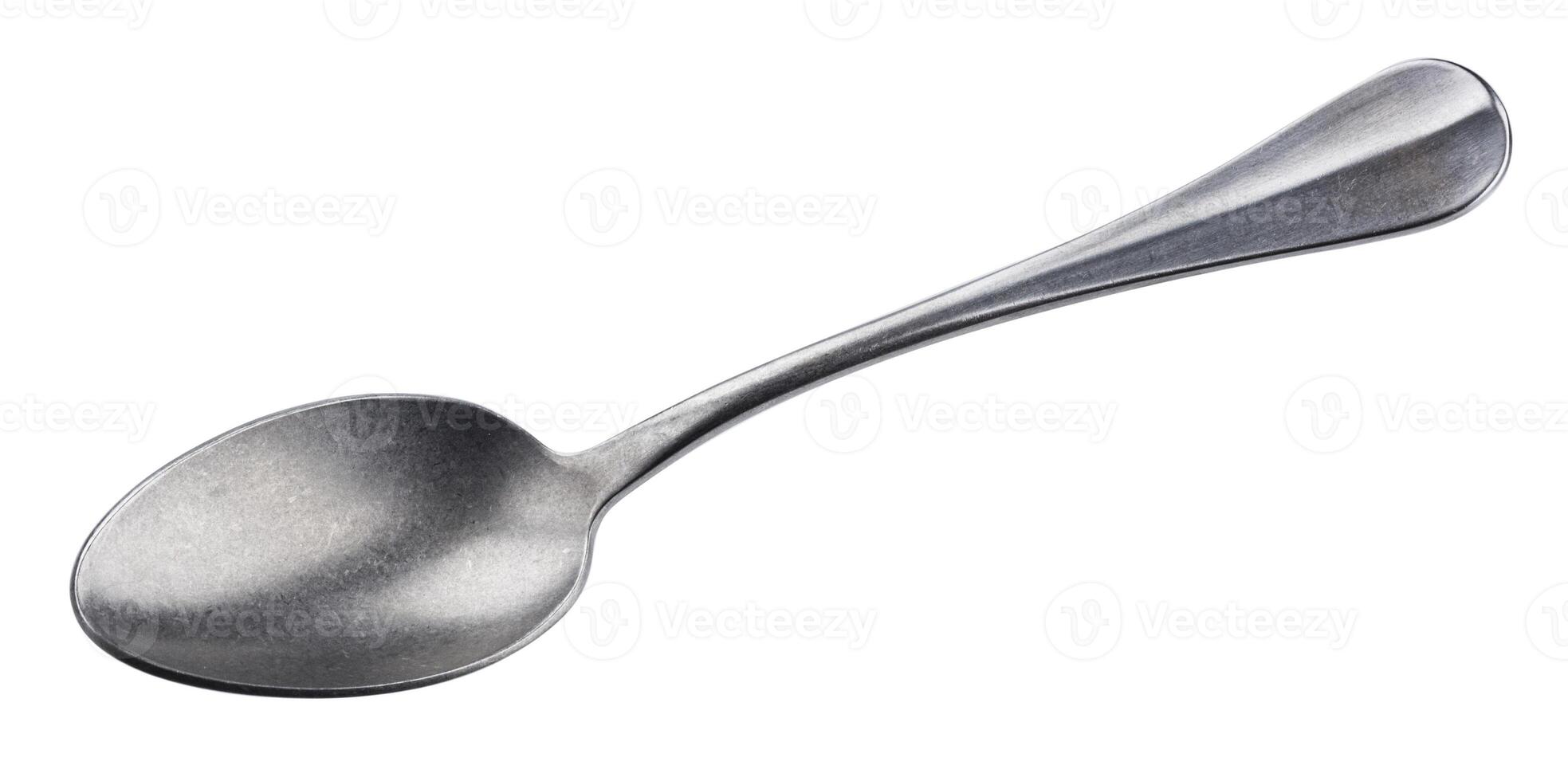 Metal spoon isolated on white background photo