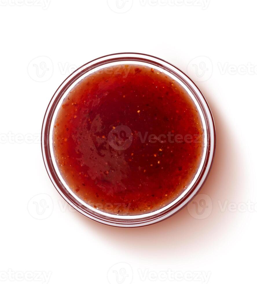 Red berry jam isolated on white background, top view photo