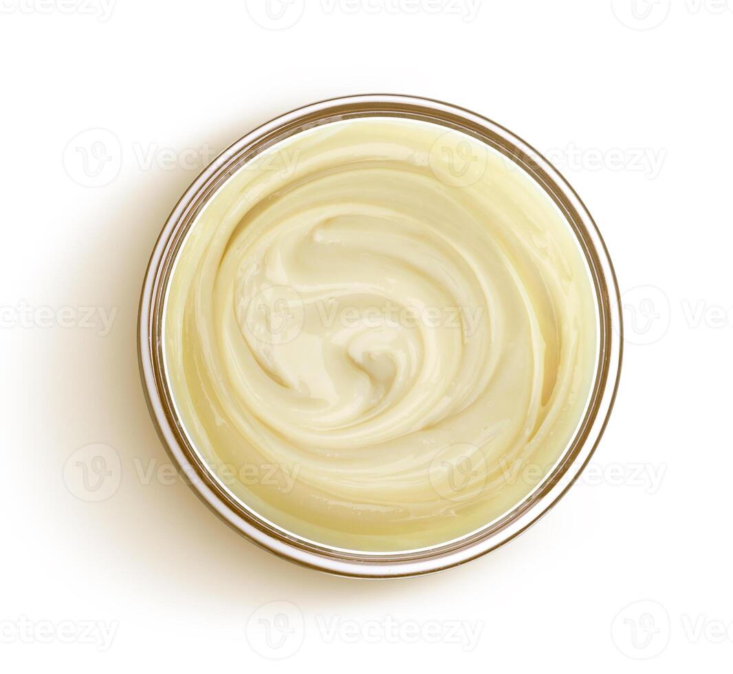 Condensed milk isolated on white background, top view photo