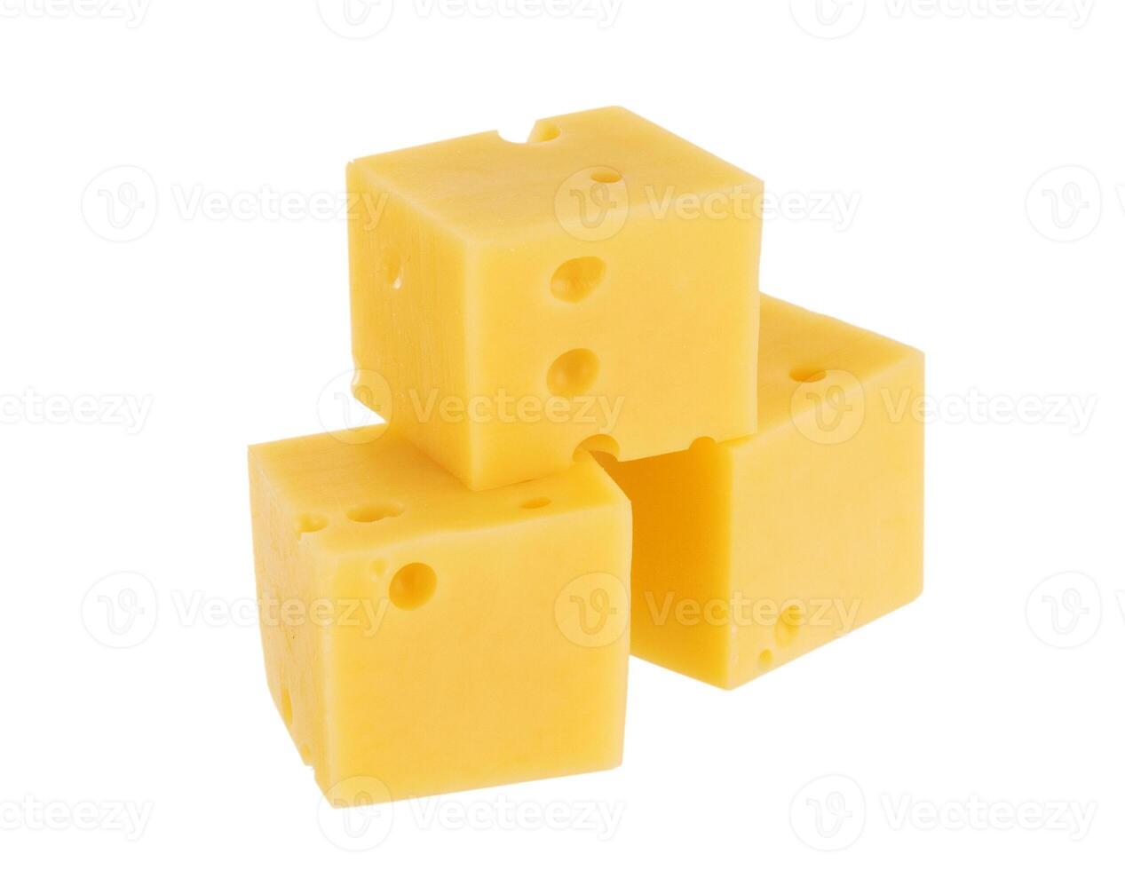 Cubes of cheese isolated on white photo