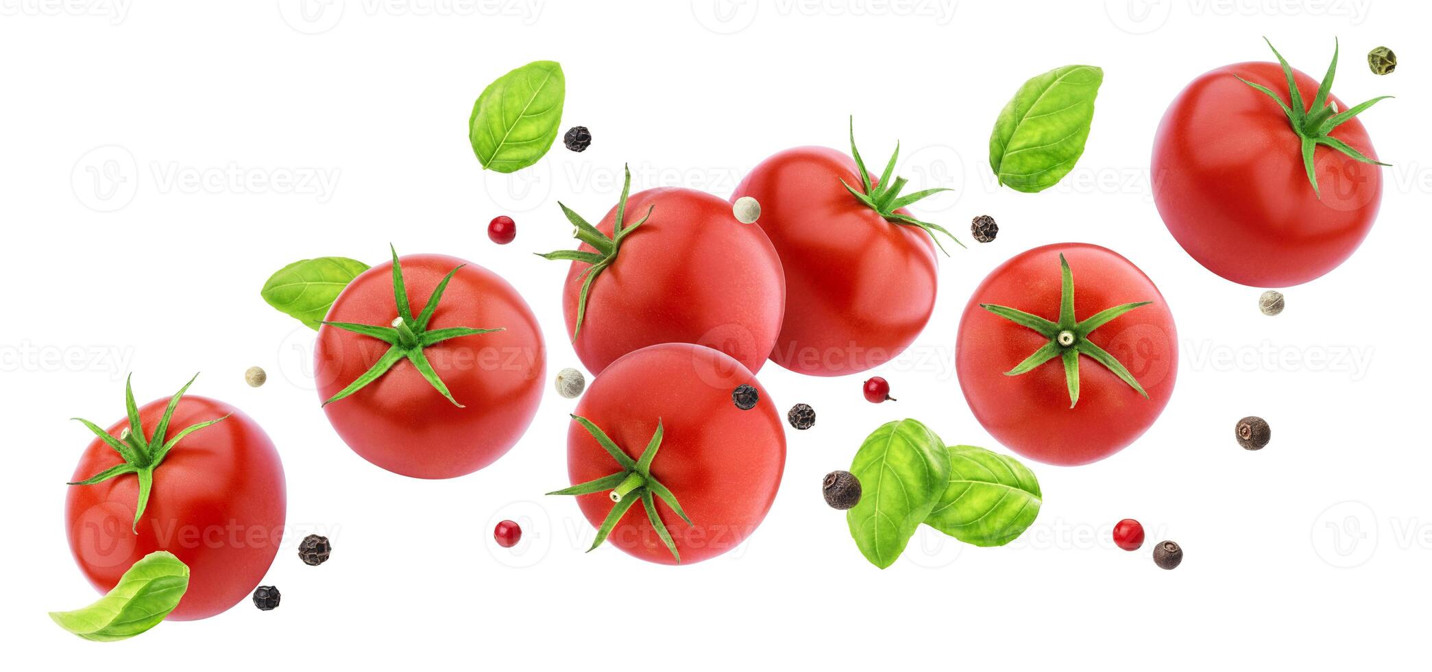 Falling tomatoes salad isolated on white background with clipping path photo