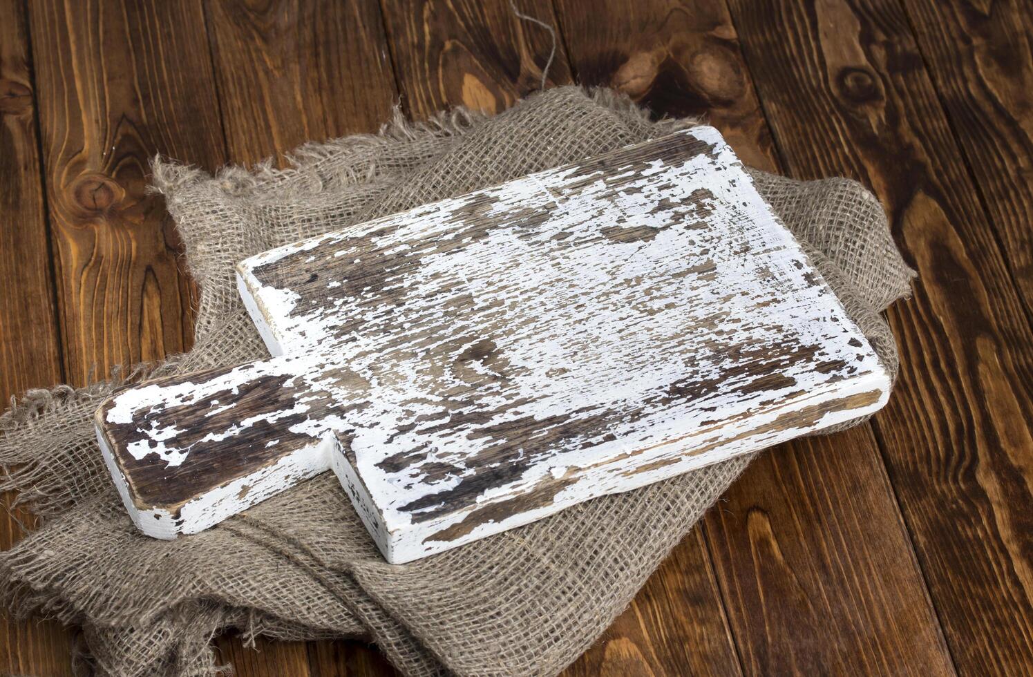 Old cutting board with burlap photo