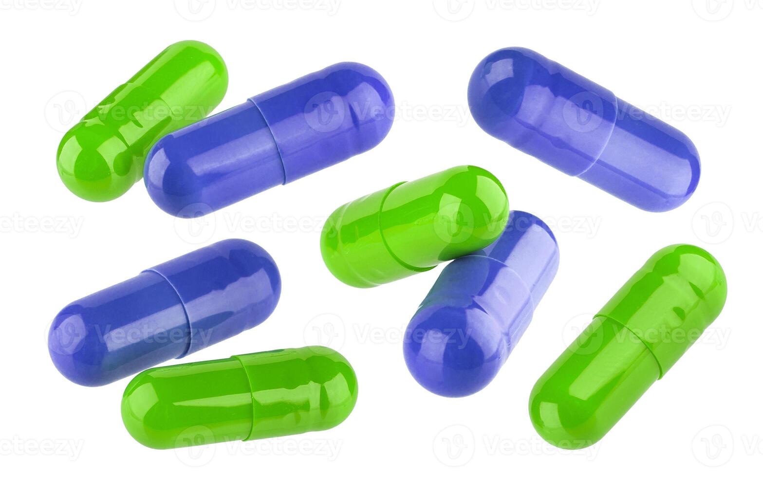 Blue and green Medical pill capsules isolated on white background photo